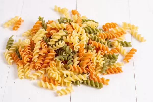 Pile of Colored Pasta on the white table