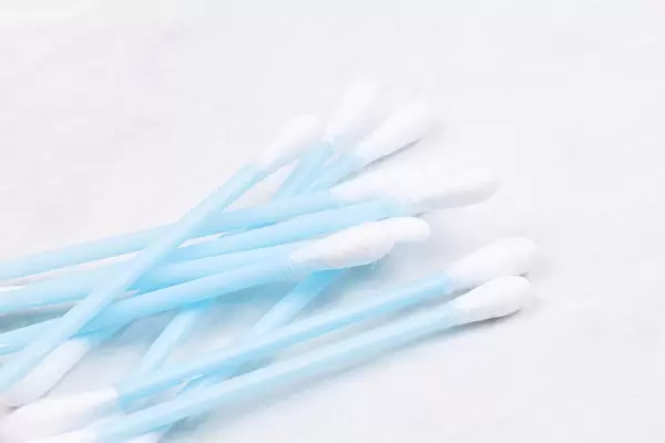 Pile of Ear Swab sticks isolated above white background