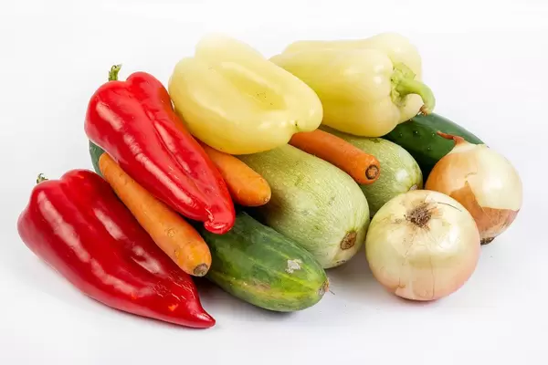 Pile of fresh vegetables on the white background