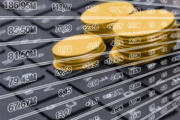 Pile of golden coins on the computer keyboard - Concept of blockchain and cryptocurrencies