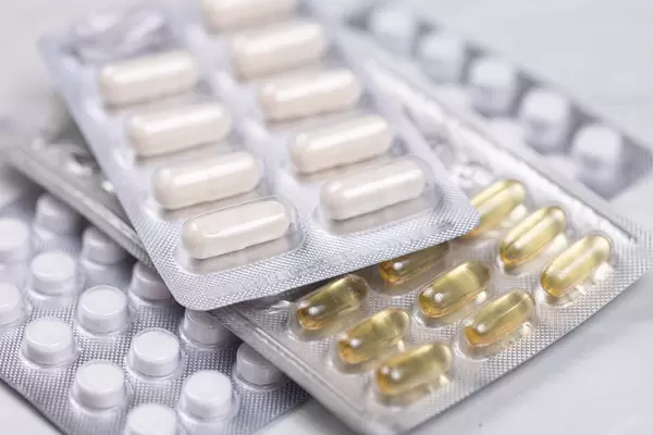 Pile of Immunity Tablets and Pills against Covid-19 virus