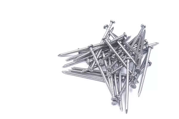Pile of Nails above white background with copy space