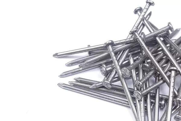 Pile of Nails above white background
