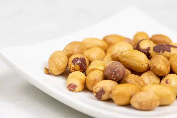 Pile of Peanuts on the white plate