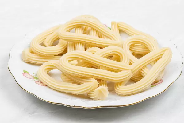 Pile of Raw Churros on the plate ready for frying