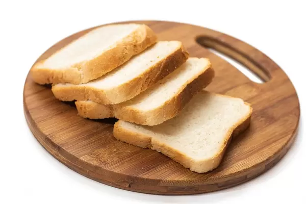 Pile of Toast bread on the round kitchen board