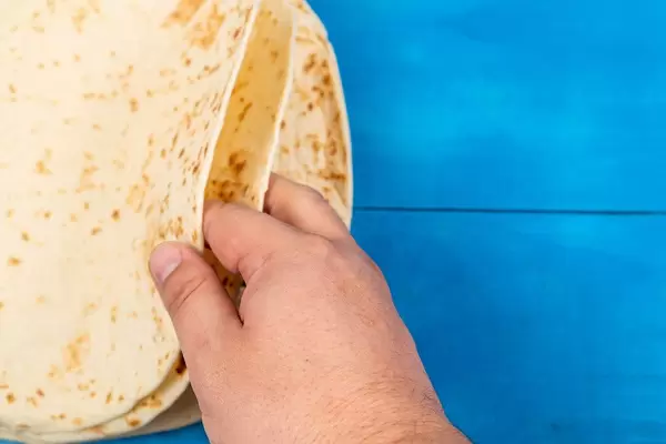 Pile of Tortillas in the hand (Flip 2020)