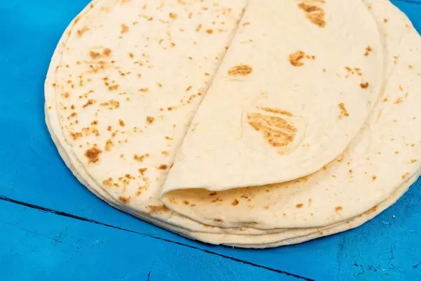 Pile of Tortillas on the blue wooden table