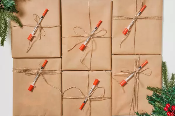 Pile of vaccine packages. Sending vaccines as Christmas gift