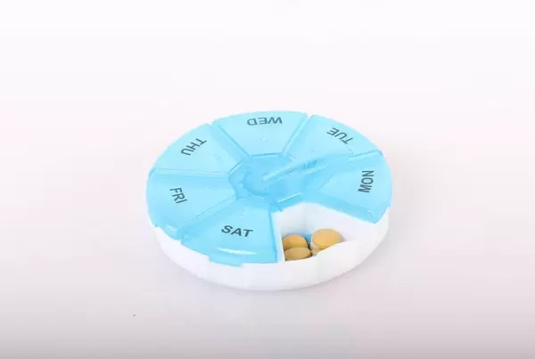 Pill reminder box on white background