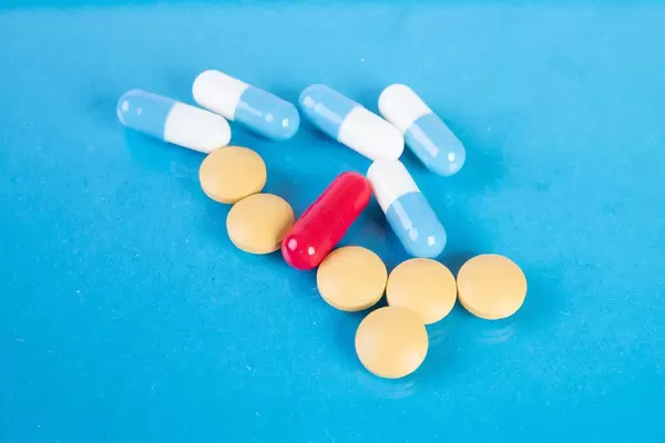 Pills on blue background (Flip 2019)