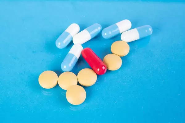 Pills on blue background