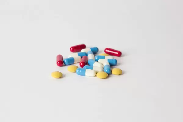 Pills on white table