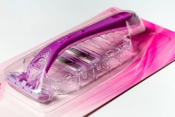 Pink female razor with blades on a white background (Flip 2020)