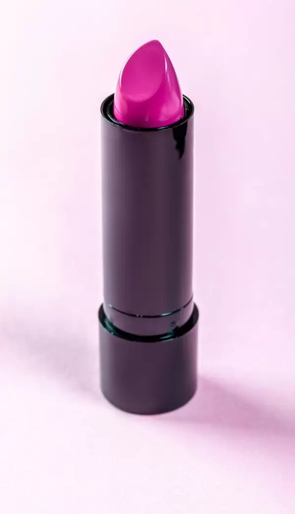 Pink lipstick on pink background