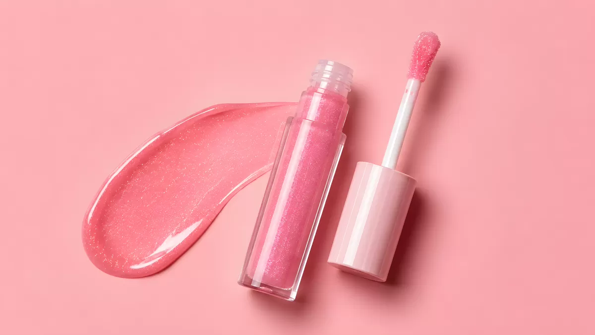 Pinker Lipgloss mit Glitzer und Textur-Abzug