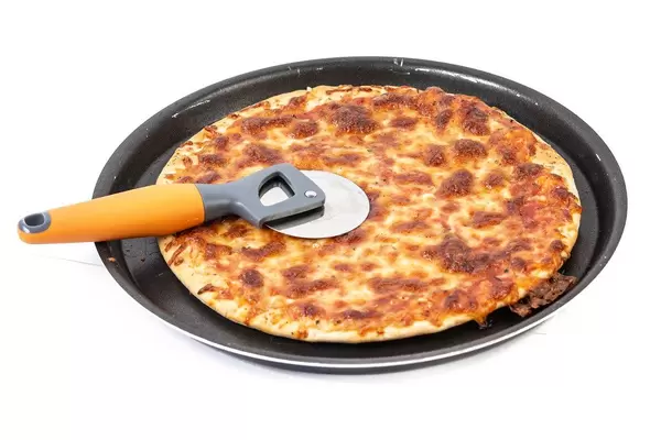Pizza Margarita on the baking tray above white background (Flip 2019)