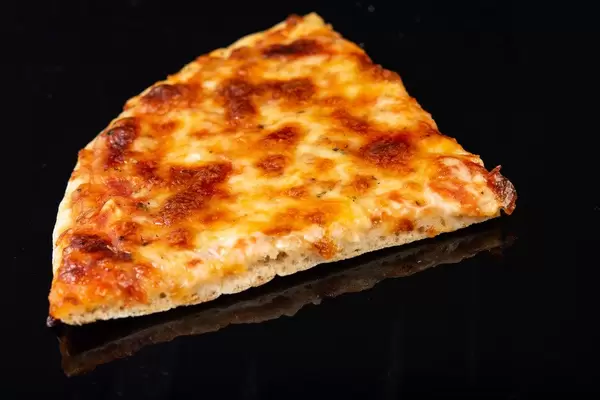 Pizza Margarita slice on the black background (Flip 2019)