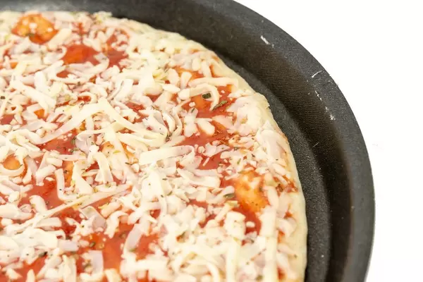 Pizza Margharita prepared for baking (Flip 2019)