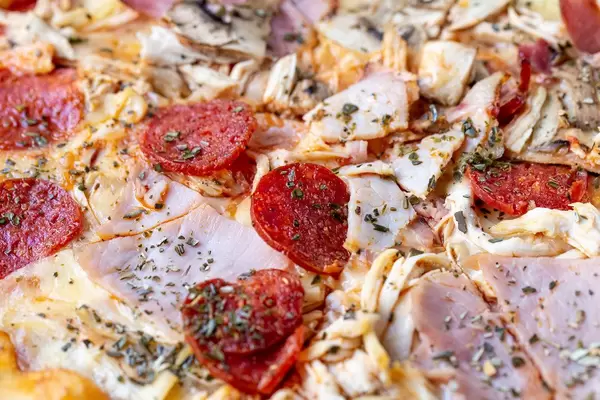 Pizza with smoked cured sausage close-up (Flip 2019) (Flip 2019)