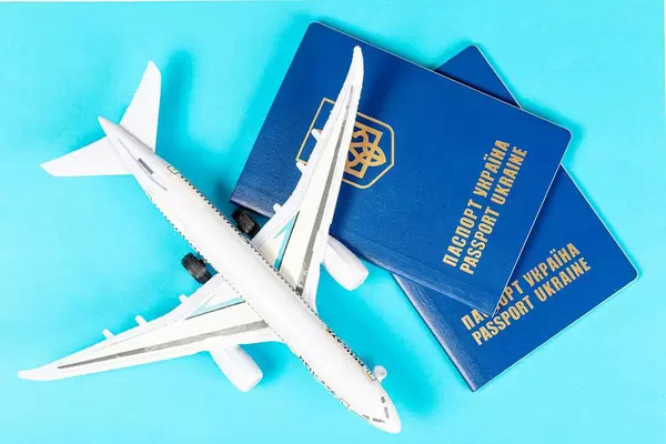 Plane travel concept- passports with plane on blue background