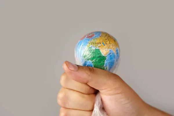 Planet Earth in plastic bag. Environmental or Ecological disasters caused by humans