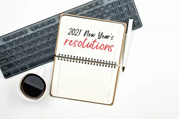 Planning goals for new year in office workspace