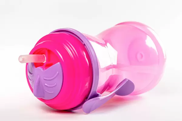 Plastic bottle with a tube for children