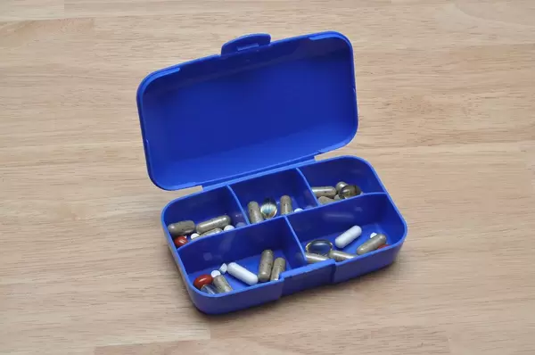Plastic manual pillbox to sort medication and drugs