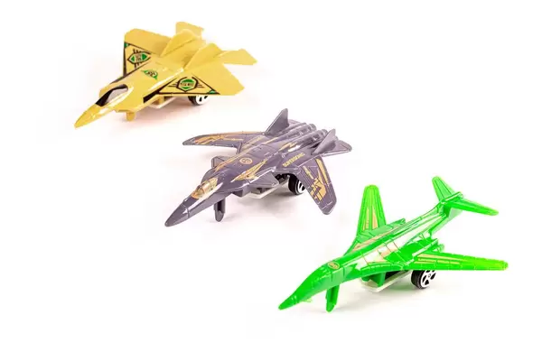 Plastic military aircraft toys on white background