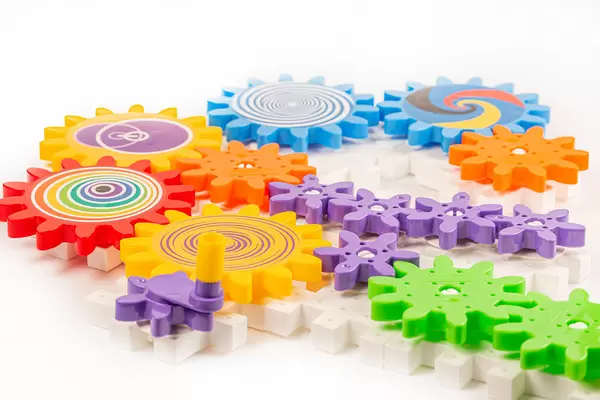 Plastic multi-colored constructor made of gear parts for children