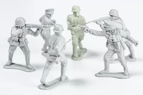 Plastic soldiers with weapons on a white background