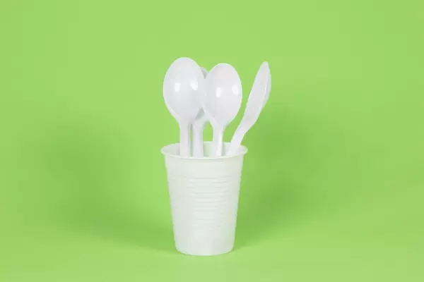 Plastic spoons in a cup