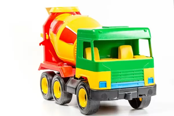 Plastic toy concrete mixer on a white background