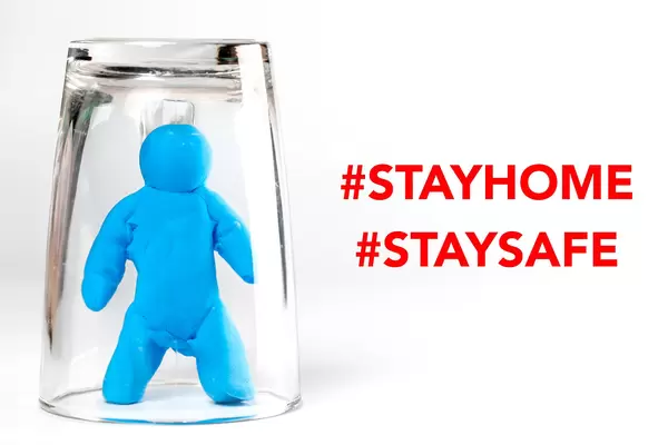 Plasticine model of a man in a glass, stay at home