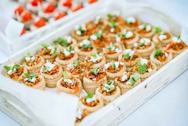 Plate of filled pastries with veggies (Flip 2019)