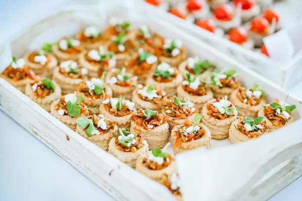 Plate of filled pastries with veggies