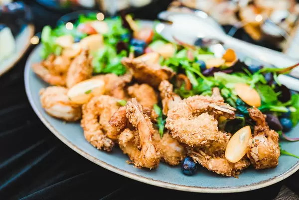 Plate Of Fried Chicken And Nuts, Berries, Salad