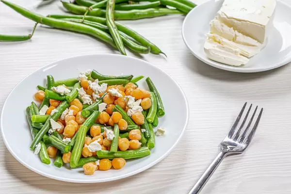 Plate with diet salad with chickpeas, asparagus and feta cheese. Healthy eating concept
