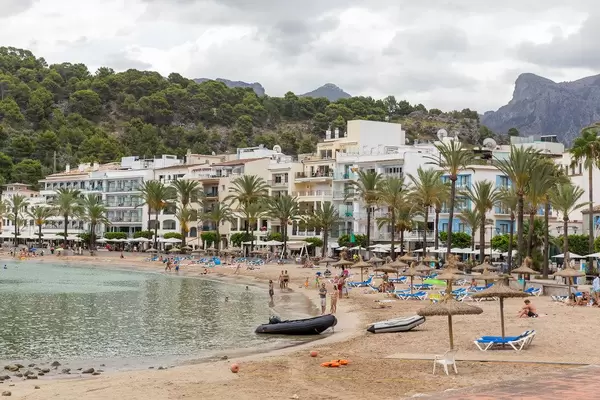 Platja d'en Repic sandy beach in Port de Sóller, Majorca. Sea promenade with palm trees and hotels