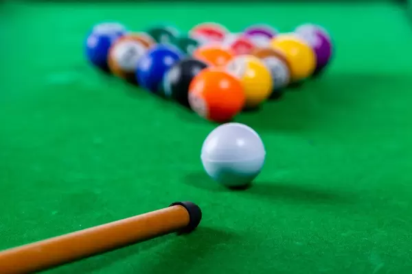 Playing Billiards with balls on the table