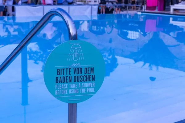Please take a shower before using the pool. Sign