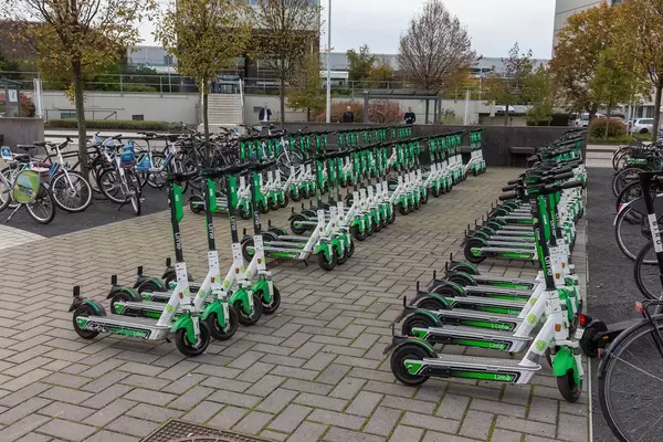 Plenty Lime Scooter aligned in Cologne