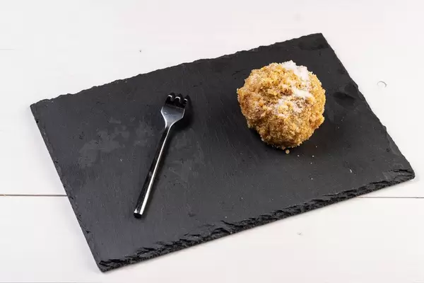 Plum Dumpling with fork on the stone tray