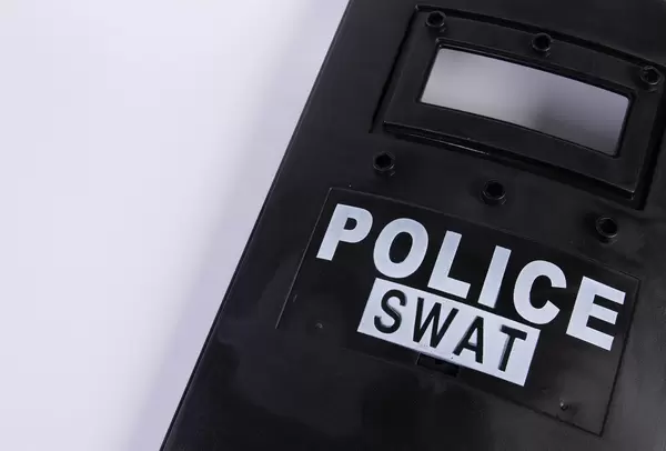 Police shield with Police Swat text on white background