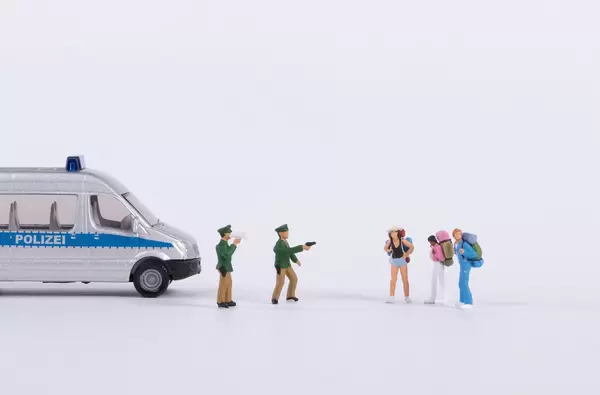 Police stopping group of backpackers