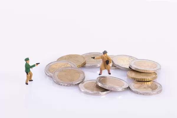 Policeman and robber pointing gun to each other