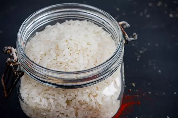 Polished white rice in glass jar