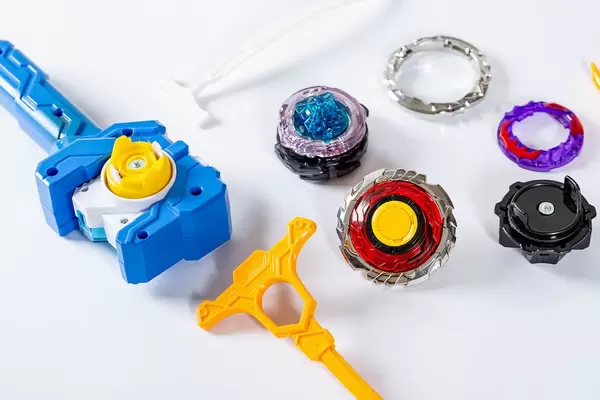 Popular children's toy - Beyblade on white background