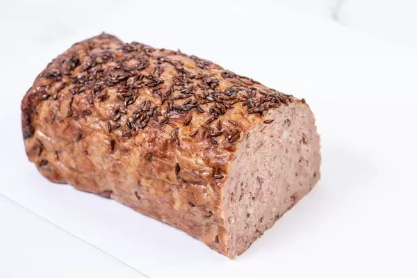 Pork and Chicken Meat Loaf with Cumin above white background (Flip 2019)